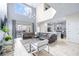 Open living room with a large sectional sofa, high ceilings and view of the pool at 601 Drop Shot Dr, Davenport, FL 33896