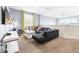 Living area with sectional sofa, coffee table, and TV at 601 Drop Shot Dr, Davenport, FL 33896