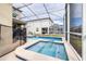 Private screened pool and spa with safety fence at 601 Drop Shot Dr, Davenport, FL 33896