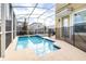 Private screened pool and spa with safety fence at 601 Drop Shot Dr, Davenport, FL 33896