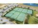 Six well-maintained tennis courts in a community setting at 601 Drop Shot Dr, Davenport, FL 33896