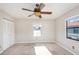 Another bedroom with carpet, ceiling fan, and window at 980 Canal View Blvd # G1, Port Orange, FL 32129