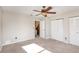 Well-lit bedroom with carpet and double closets at 980 Canal View Blvd # G1, Port Orange, FL 32129