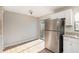 Modern kitchen with white cabinets, granite counters, and stainless steel appliances at 980 Canal View Blvd # G1, Port Orange, FL 32129