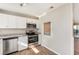 Updated kitchen features stainless steel appliances and granite countertops at 980 Canal View Blvd # G1, Port Orange, FL 32129