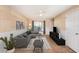 Spacious living room with gray sectional sofa, wood floors, and modern decor at 980 Canal View Blvd # G1, Port Orange, FL 32129