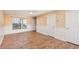 Bright living room with white wainscoting and wood-look floors at 980 Canal View Blvd # G1, Port Orange, FL 32129