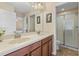 Clean bathroom with double vanity, large mirror, and a walk-in shower at 1463 Myrtlewood St, Davenport, FL 33896