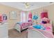 Charming bedroom with twin beds, Disney princess theme, and decorative wall art at 1463 Myrtlewood St, Davenport, FL 33896