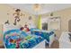 bedroom with twin beds, Toy Story theme, and fun wall decals at 1463 Myrtlewood St, Davenport, FL 33896