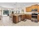 Spacious kitchen with stainless steel appliances and granite countertops at 1463 Myrtlewood St, Davenport, FL 33896