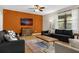 Living room with sectional sofa and an accent wall at 1463 Myrtlewood St, Davenport, FL 33896