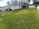 Large backyard with grassy area and white fence at 4209 Pecan Ln, Orlando, FL 32812