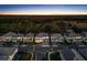 Stunning aerial view of homes at sunset with nature views at 2541 Shanti Dr, Kissimmee, FL 34746