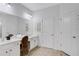 Double vanity bathroom with stylish chair and ample counter space at 2541 Shanti Dr, Kissimmee, FL 34746