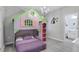 Playful bedroom with a dollhouse bunk bed at 2541 Shanti Dr, Kissimmee, FL 34746