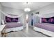 Two twin beds with galaxy themed decor at 2541 Shanti Dr, Kissimmee, FL 34746
