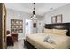 Bedroom with king-size bed, unique decor, and en-suite bathroom at 2541 Shanti Dr, Kissimmee, FL 34746