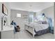 Bedroom with a queen bed and elegant decor at 2541 Shanti Dr, Kissimmee, FL 34746