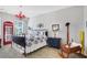 Charming bedroom with a vintage telephone booth and unique decor at 2541 Shanti Dr, Kissimmee, FL 34746
