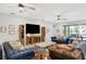 Relaxing living room featuring comfortable sofas and large TV at 2541 Shanti Dr, Kissimmee, FL 34746