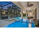 Enclosed pool and spa area with ping pong table and seating at 2541 Shanti Dr, Kissimmee, FL 34746