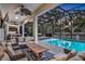 Screened pool and patio area with comfortable seating at 2541 Shanti Dr, Kissimmee, FL 34746