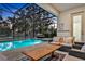 Covered patio area with seating and a view of the pool at 2541 Shanti Dr, Kissimmee, FL 34746