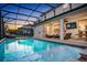 Relaxing screened-in pool with a tiled deck and lounge area at 2541 Shanti Dr, Kissimmee, FL 34746