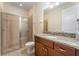 Bathroom with granite vanity and a large shower at 501 Lasso Dr, Kissimmee, FL 34747