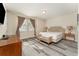 Main bedroom with king bed and access to en-suite bathroom at 501 Lasso Dr, Kissimmee, FL 34747