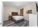 Bedroom with a queen bed, wood-look floors, and neutral decor at 501 Lasso Dr, Kissimmee, FL 34747