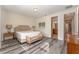Main bedroom with king bed, and en-suite bathroom access at 501 Lasso Dr, Kissimmee, FL 34747