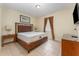 Bright bedroom with a comfortable bed and wood nightstands at 501 Lasso Dr, Kissimmee, FL 34747