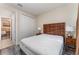 Bedroom with a queen bed, nightstands, and access to a bathroom at 501 Lasso Dr, Kissimmee, FL 34747