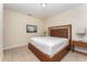 Bedroom with wooden bed frame and nightstands at 501 Lasso Dr, Kissimmee, FL 34747
