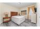 Guest bedroom with a full-size bed and wood nightstand at 501 Lasso Dr, Kissimmee, FL 34747