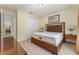 Guest bedroom with a queen-size bed and access to a hallway at 501 Lasso Dr, Kissimmee, FL 34747