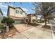 Two-story house on tree-lined street with brick driveway at 501 Lasso Dr, Kissimmee, FL 34747