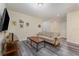 Cozy living room with a sofa, coffee table, and wood-look floors at 501 Lasso Dr, Kissimmee, FL 34747