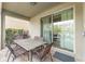 Covered patio with table, chairs, and grill at 501 Lasso Dr, Kissimmee, FL 34747