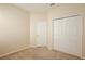 Spacious bedroom with neutral walls and carpet at 1550 Cedar Lake Dr, Orlando, FL 32824