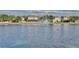 Tranquil lake view with fountain and neighborhood homes at 1550 Cedar Lake Dr, Orlando, FL 32824