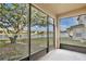 Peaceful screened porch overlooking a lake at 1550 Cedar Lake Dr, Orlando, FL 32824