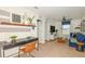 Bright bonus room with a desk, seating area, and stylish decor at 264 Woodsage Pl, Lake Alfred, FL 33850
