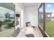 Relaxing screened porch with comfy seating, overlooking the backyard at 264 Woodsage Pl, Lake Alfred, FL 33850