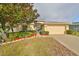Single-story home with a two-car garage and well-manicured lawn at 3379 Fiddle Leaf Way, Lakeland, FL 33811
