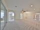 Bright and airy living room with neutral carpeting and an open design at 3379 Fiddle Leaf Way, Lakeland, FL 33811