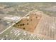 Aerial view showing a home on a lot surrounded by farmland at 6085 Lightsey Rd, Fort Meade, FL 33841
