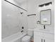 Bathroom with marble shower, white vanity, and modern fixtures at 6085 Lightsey Rd, Fort Meade, FL 33841
